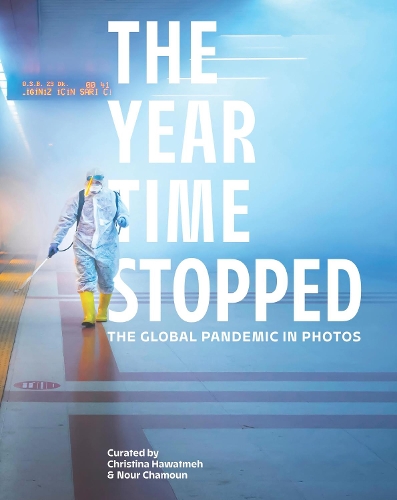 Паперова книга «The Year Time Stopped: The Global Pandemic in Photos», авторів Крістіна Хаватмех, Нур Шамун - фото №1