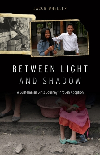 Паперова книга «Between Light and Shadow: A Guatemalan Girl's Journey through Adoption», автор Якоб Р. Вілер - фото №1