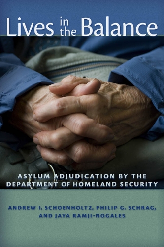 Паперова книга «Lives in the Balance: Asylum Adjudication by the Department of Homeland Security», авторів Ендрю І. Шенгольц, Джая Рамджі-Ногалес, Філіп Г. Шраг - фото №1