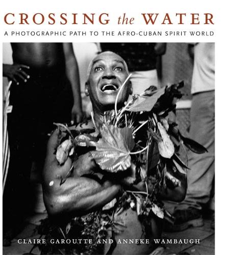Бумажная книга «Crossing the Water: A Photographic Path to the Afro-Cuban Spirit World», авторов Аннеке Вамбо, Клэр Гарутте - фото №1